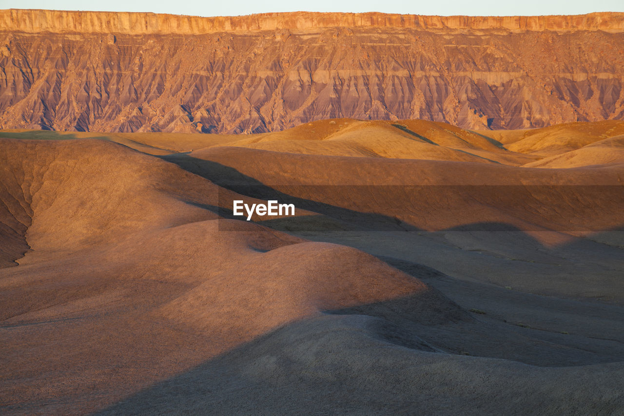 North caineville mesa and badlands at sunrise, upper blue hills, utah