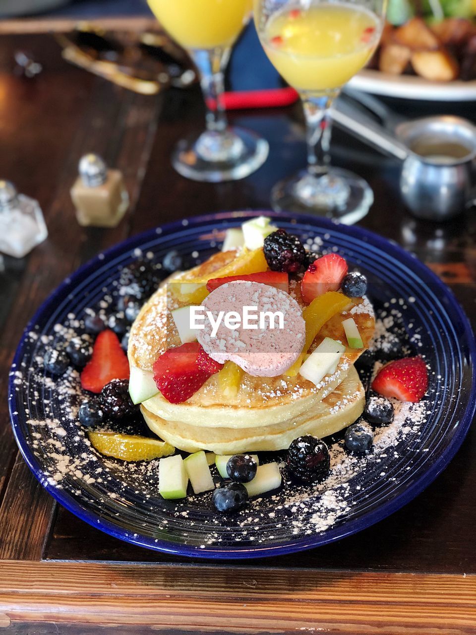 HIGH ANGLE VIEW OF FRUITS SERVED ON TABLE