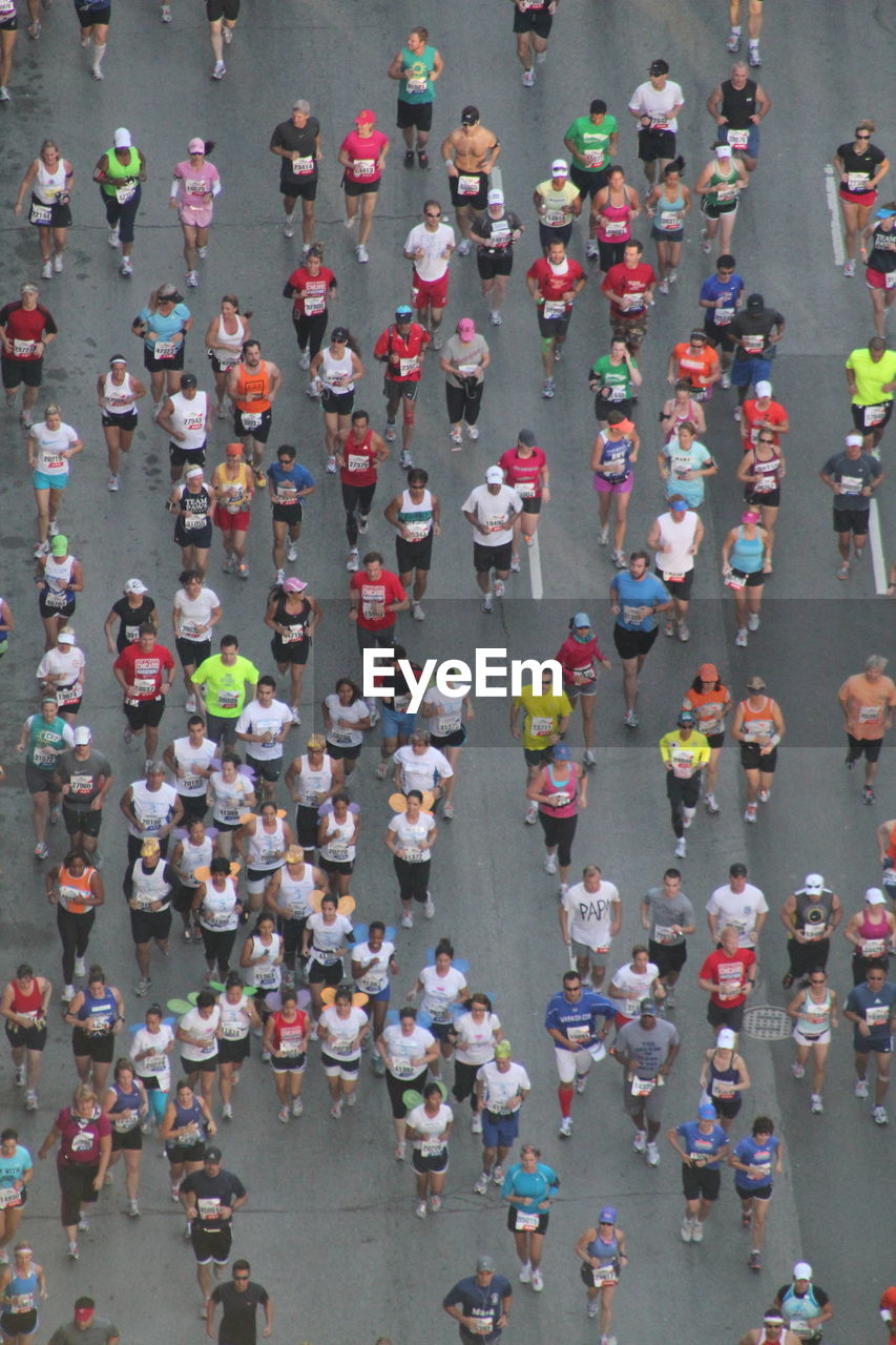 High angle view of crowd running on road during marathon in city