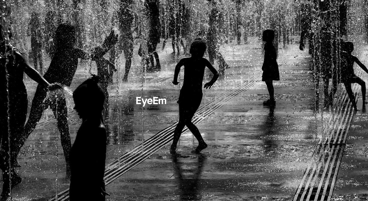 WOMAN STANDING IN WATER