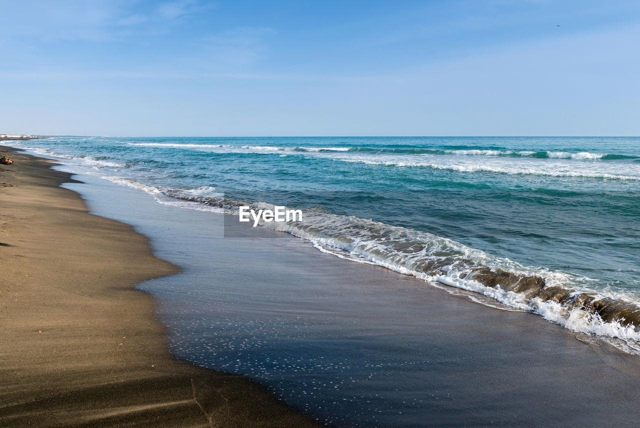 Beautiful sea and the black sandy beach, tyrrhenian sea near roma, italy