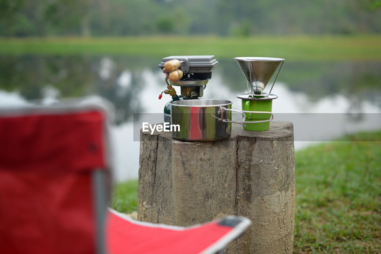 CLOSE-UP OF DRINK ON TABLE BY FIELD