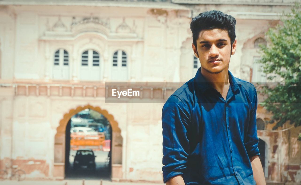 Portrait of handsome young man during sunny day