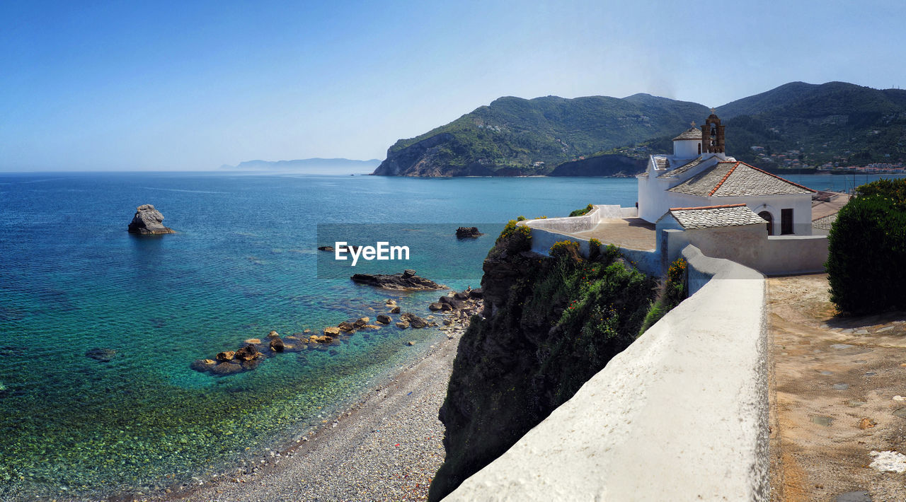 Scenic view of sea and buildings against sky