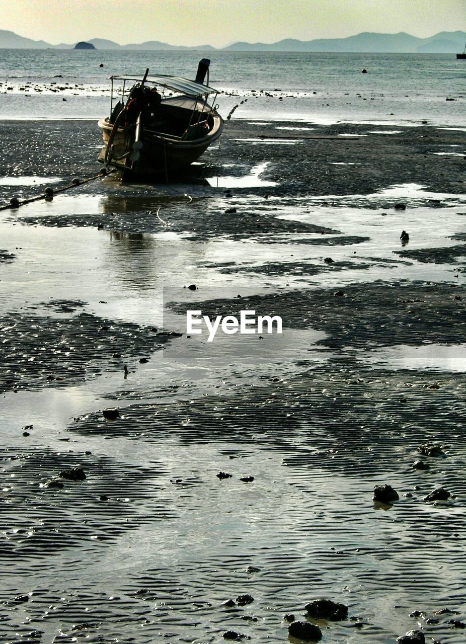 Lone boat on sea shore