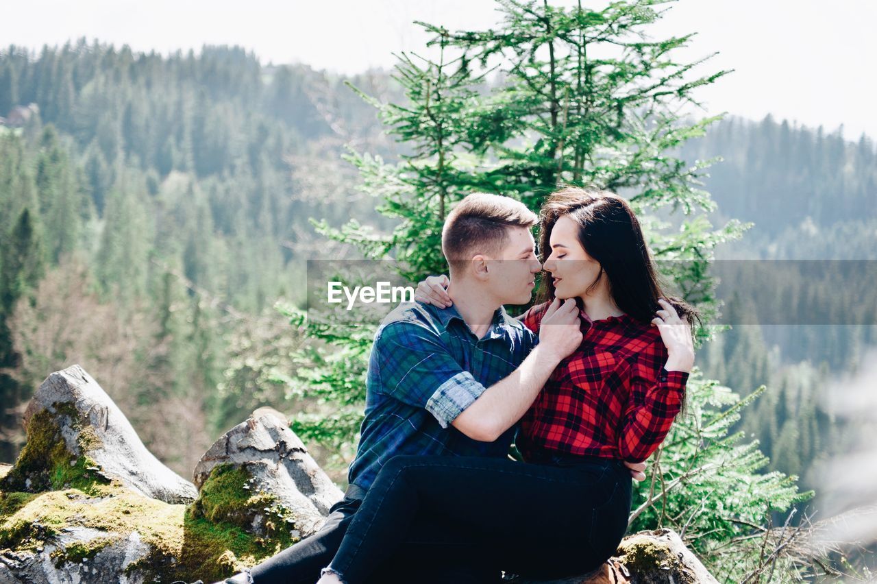 Loving young couple in forest