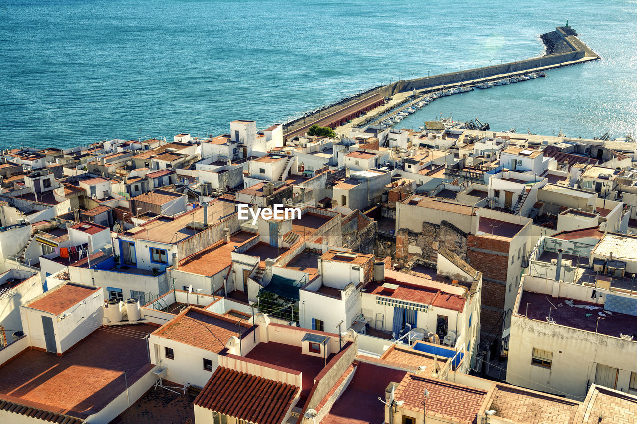 High angle view of houses by sea