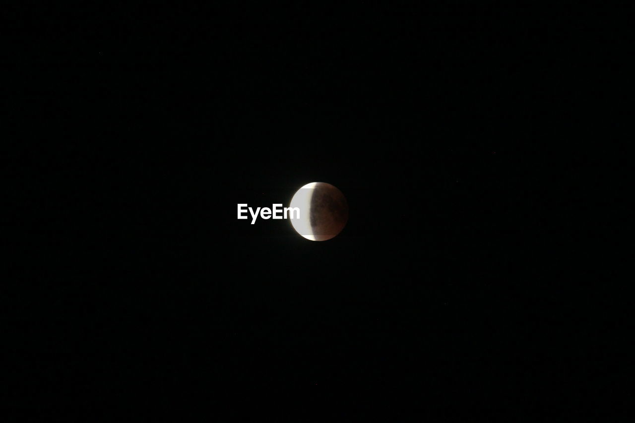 LOW ANGLE VIEW OF MOON AGAINST SKY