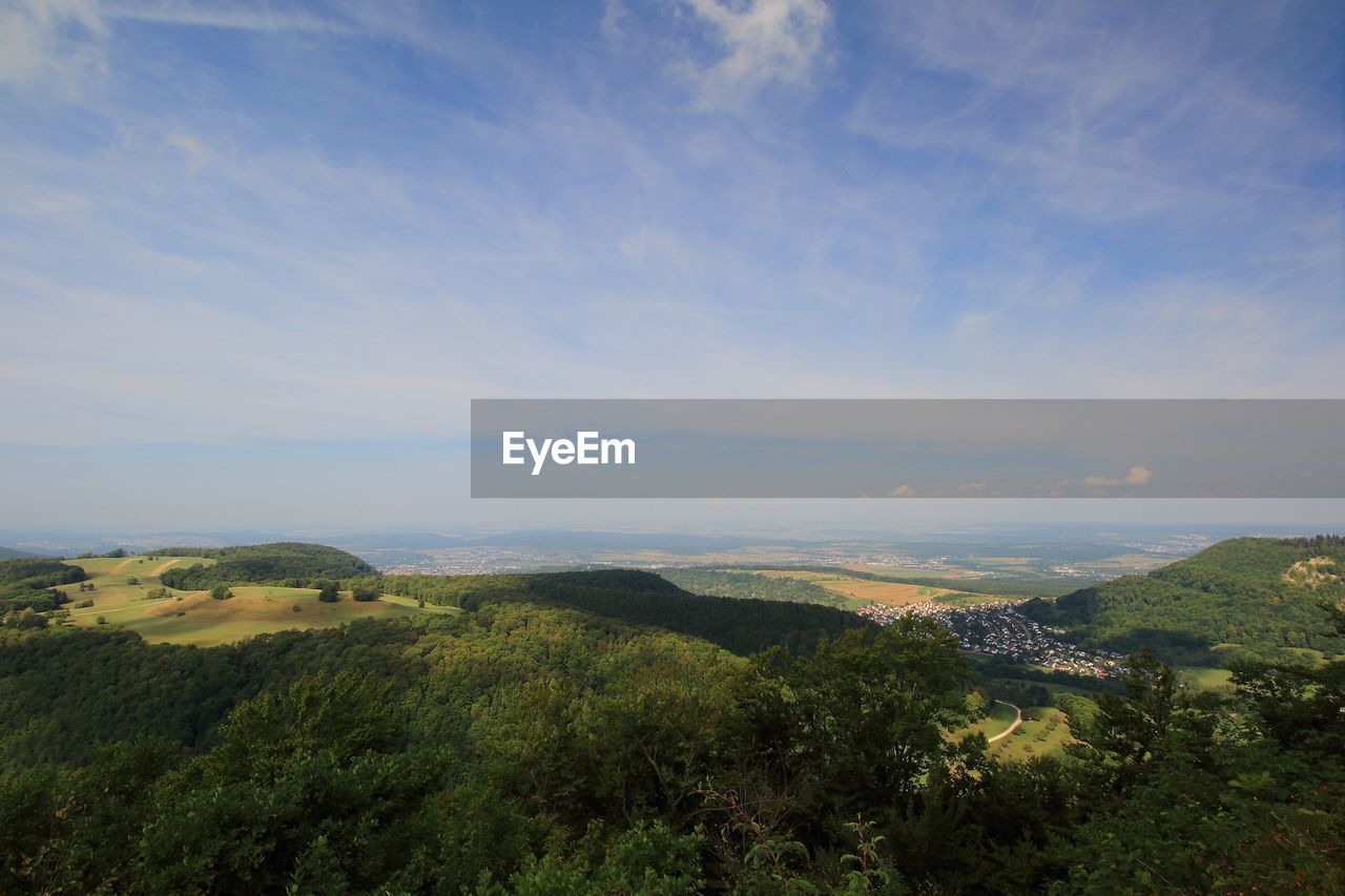 sky, hill, scenics - nature, environment, beauty in nature, nature, landscape, plant, tranquility, cloud, land, tree, tranquil scene, horizon, no people, green, natural environment, outdoors, non-urban scene, day, growth, idyllic, mountain range, high angle view, ridge, architecture, rural area, forest, morning, plateau, sunlight, travel, travel destinations, wilderness, water