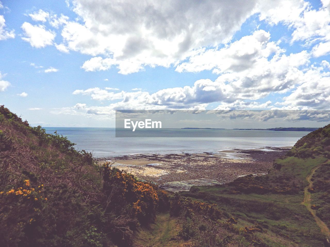 VIEW OF SEA AGAINST CLOUDY SKY