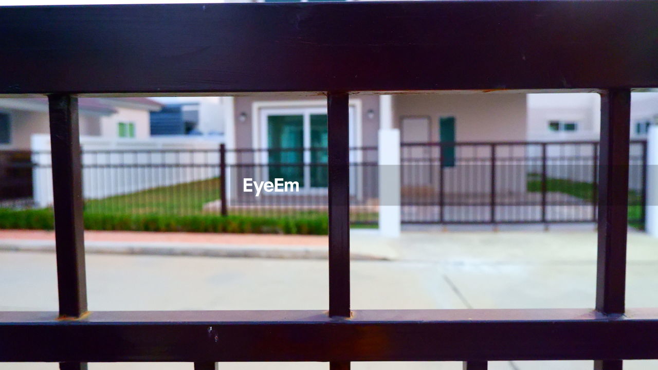 EMPTY ROAD SEEN THROUGH WINDOW