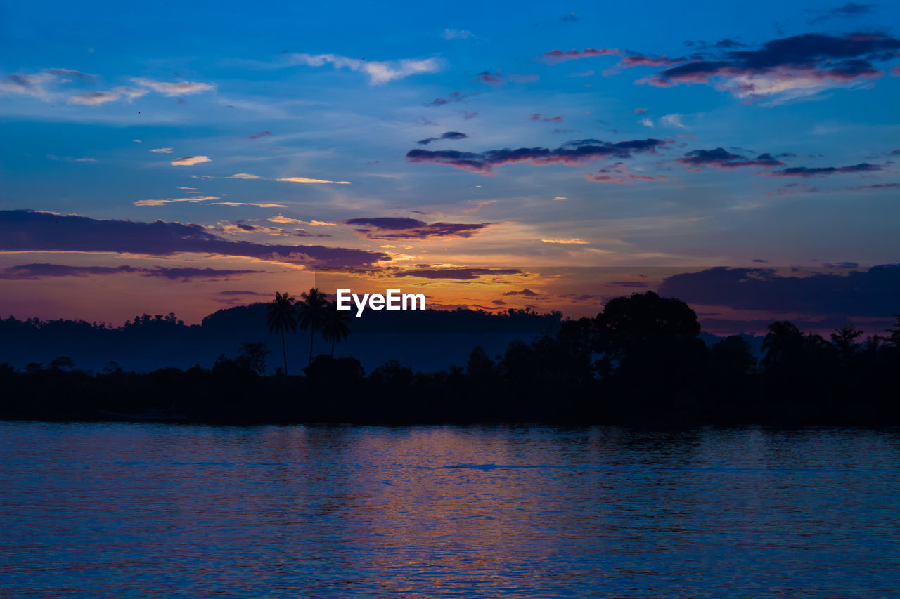 Scenic view of lake against sky during sunset