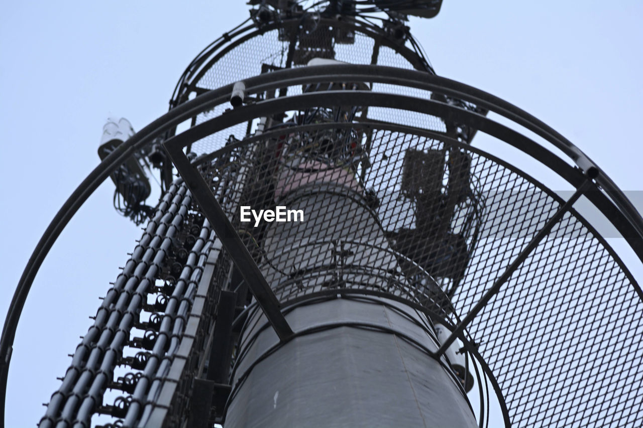 amusement park, roller coaster, amusement ride, low angle view, sky, park, architecture, built structure, no people, clear sky, arts culture and entertainment, nature, day, metal, outdoors, iron, amusement park ride