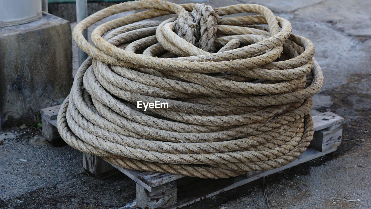 High angle view of ropes wound on pallet