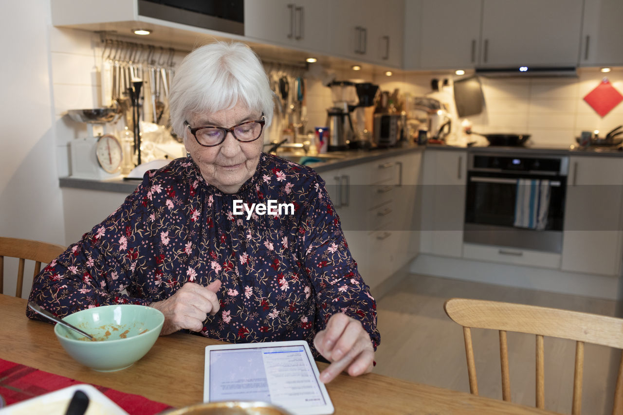 Senior woman using digital tablet