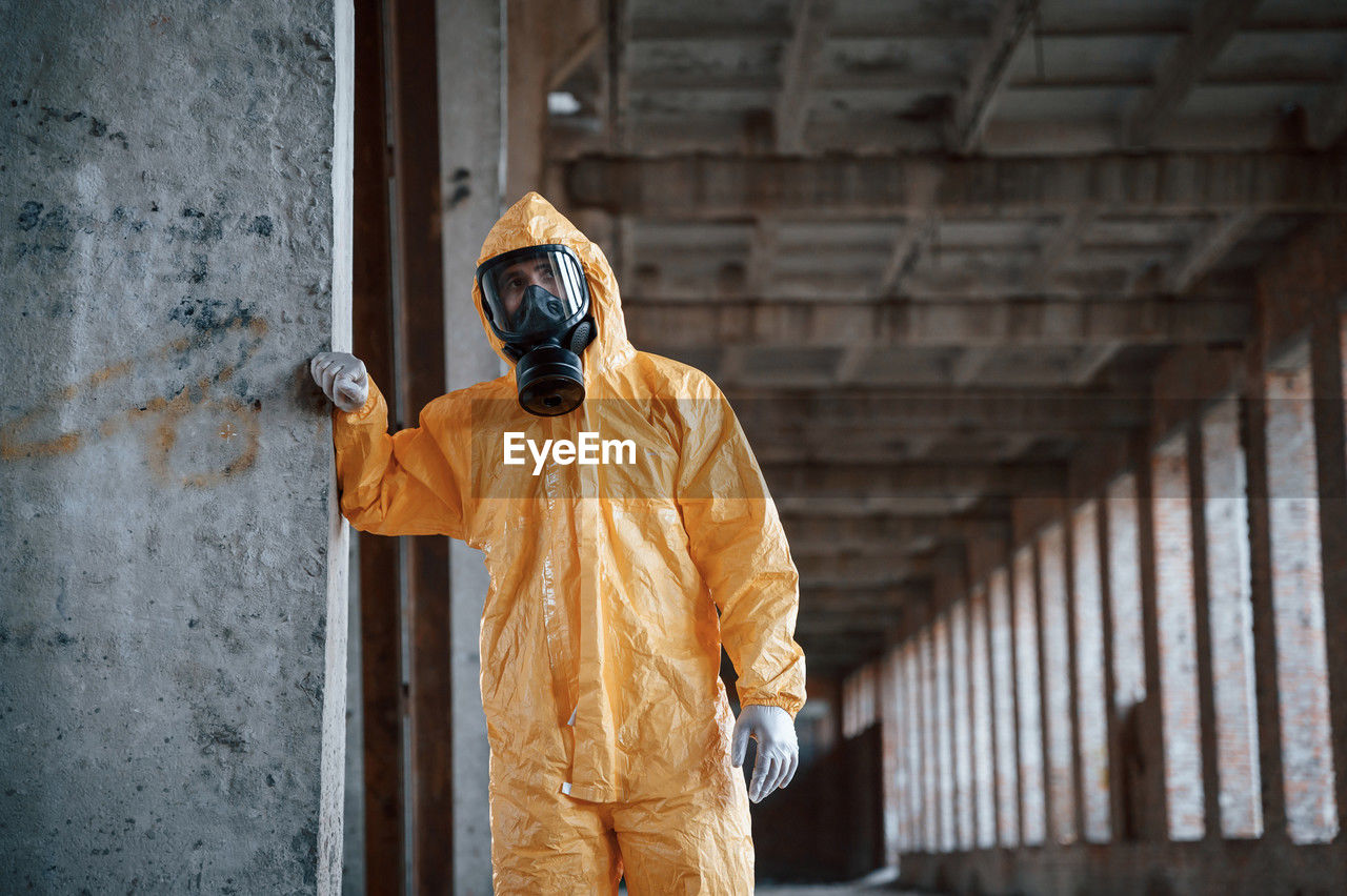 temple, clothing, one person, architecture, men, protection, adult, person, hazmat suit, security, mask, built structure, standing, statue, protective mask - workwear, occupation, protective workwear