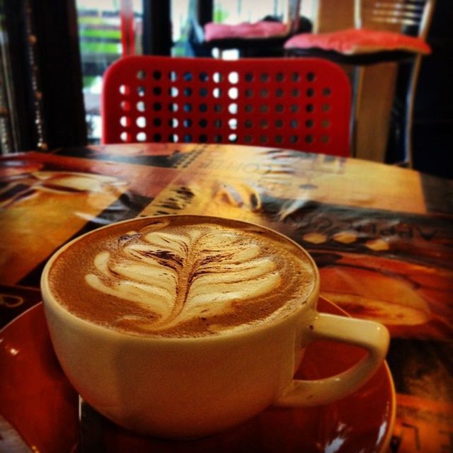 CLOSE-UP OF COFFEE CUP ON TABLE