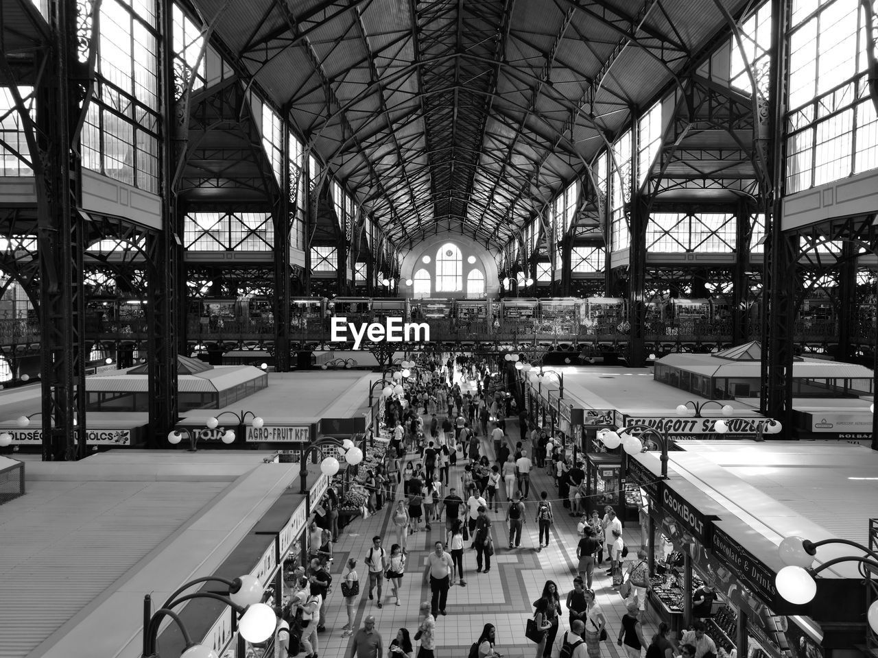 PEOPLE SITTING IN RAILROAD STATION