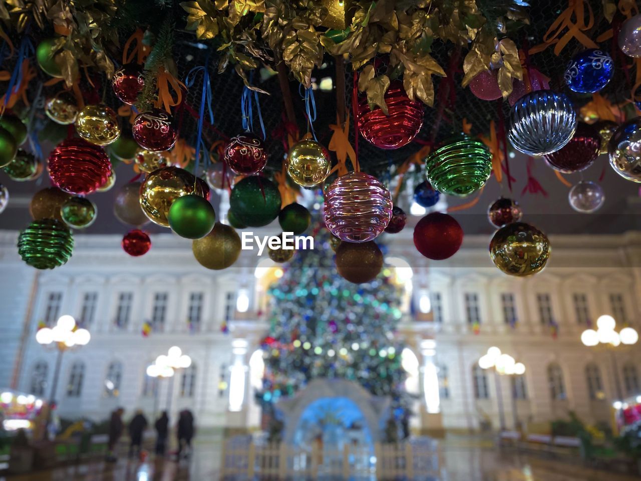 Colorful christmas baubles decorating the city at night