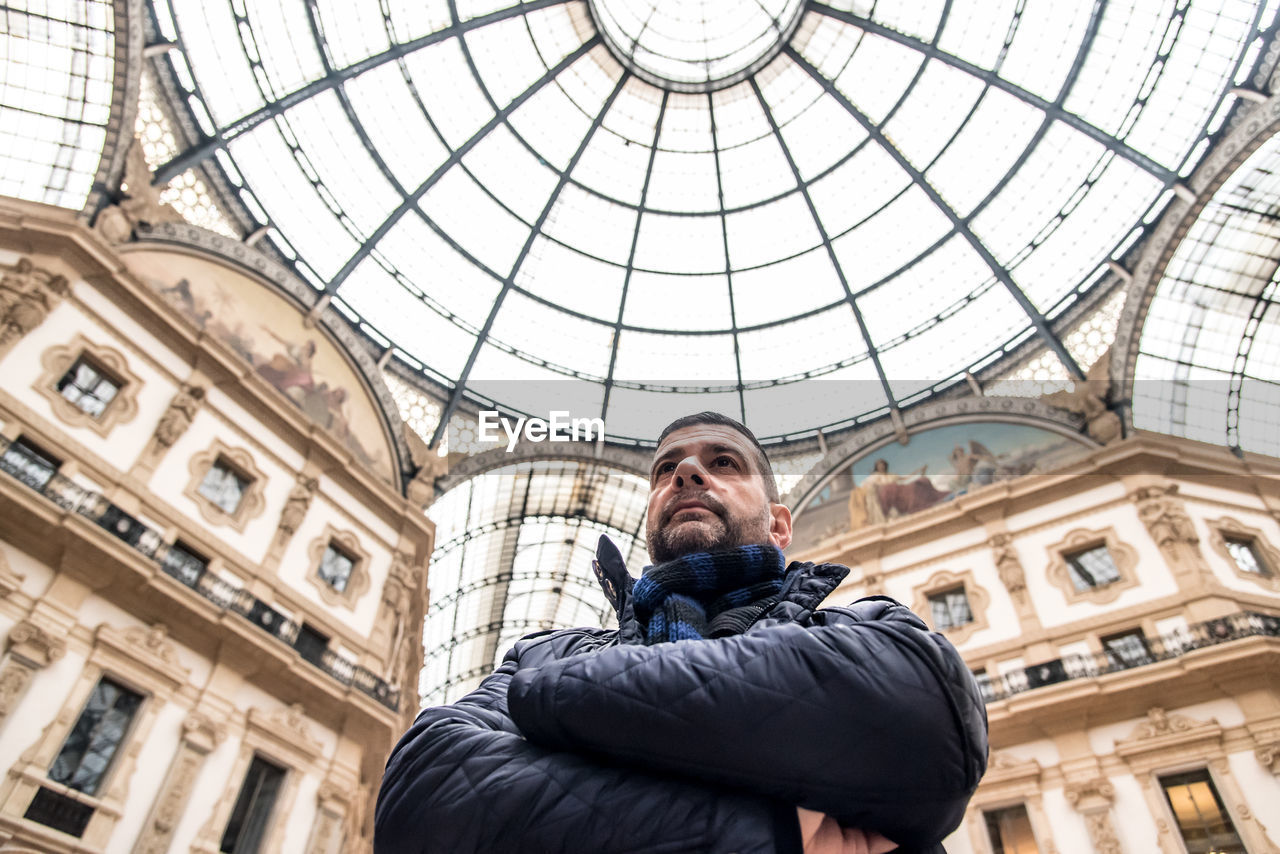 Low angle view of man in galleria vittorio emanuele ii