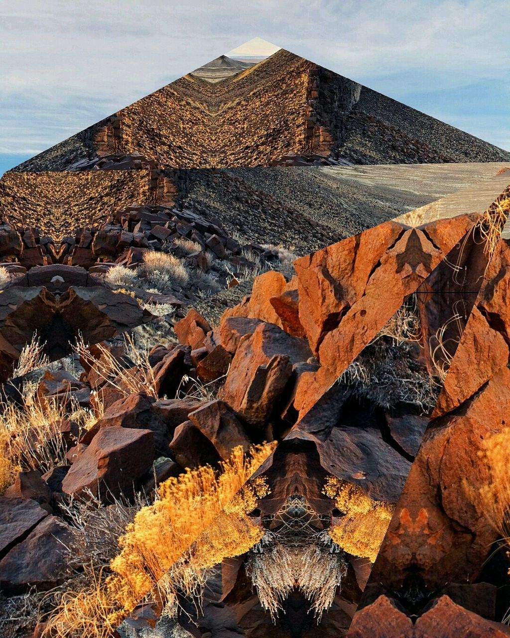 AERIAL VIEW OF MOUNTAIN AGAINST SKY