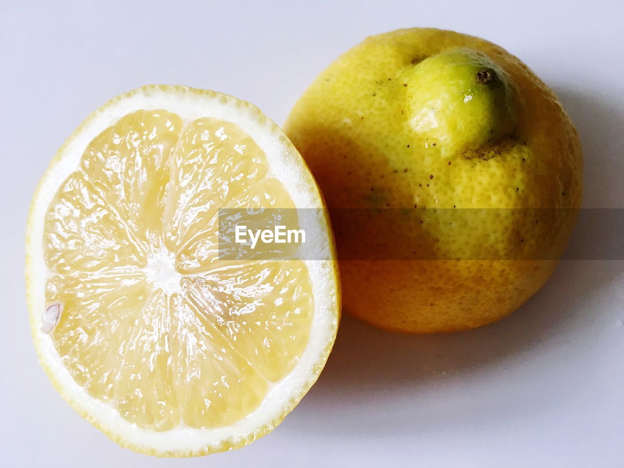 Close-up of lemon slice on white table