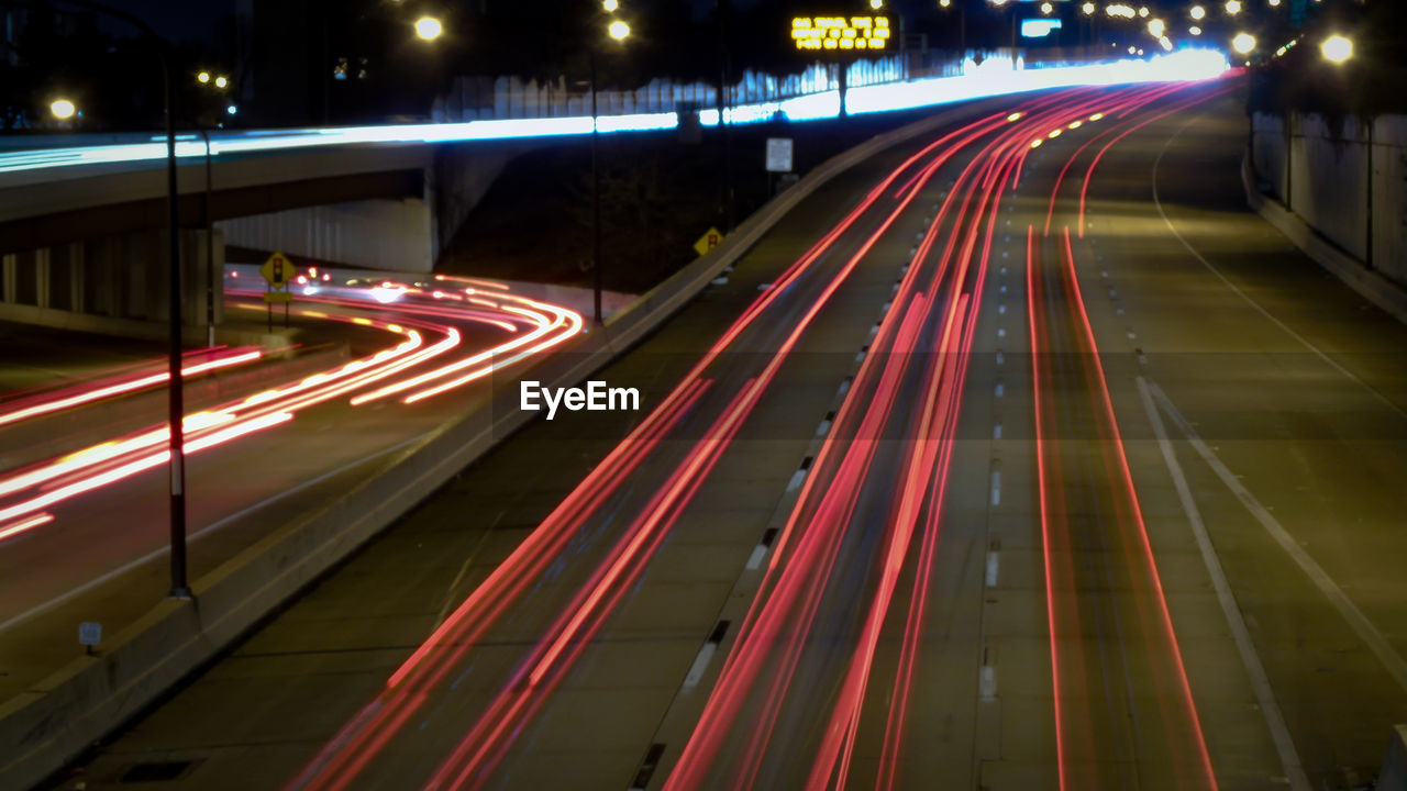 High angle view of light trails on road at night