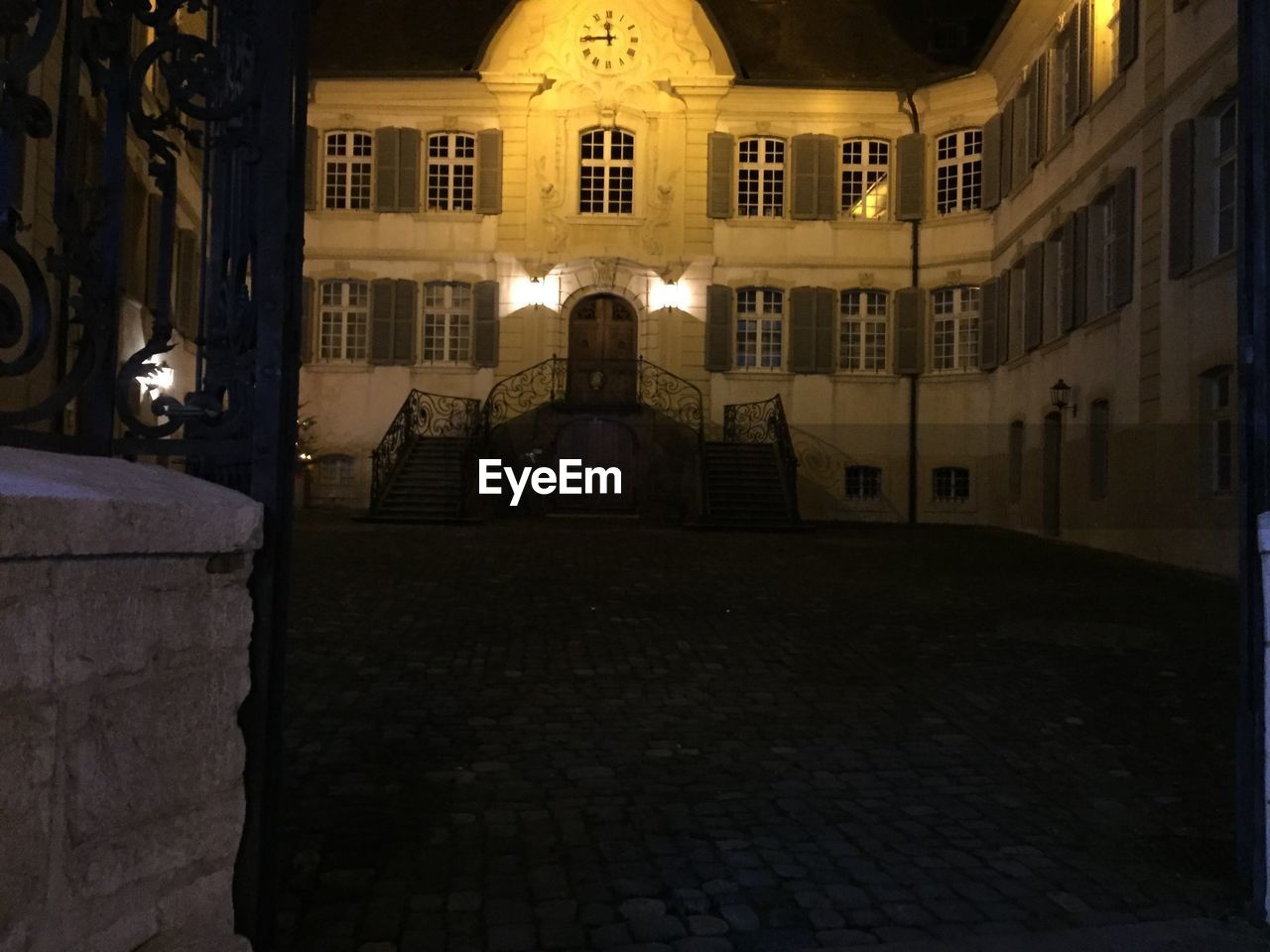 VIEW OF ILLUMINATED BUILDINGS AT NIGHT