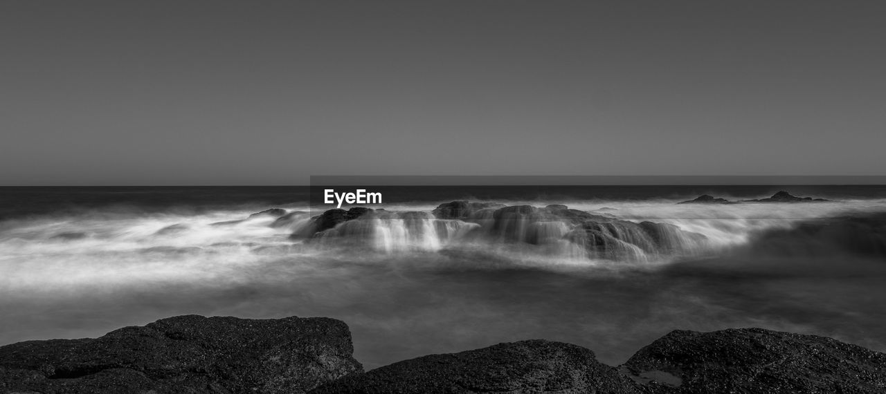 Scenic view of sea against clear sky