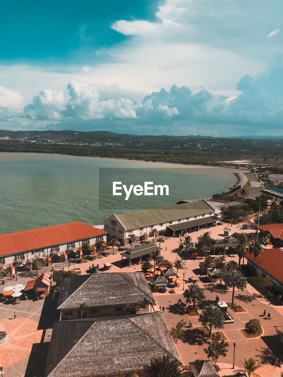 Aerial view of sea against cloudy sky