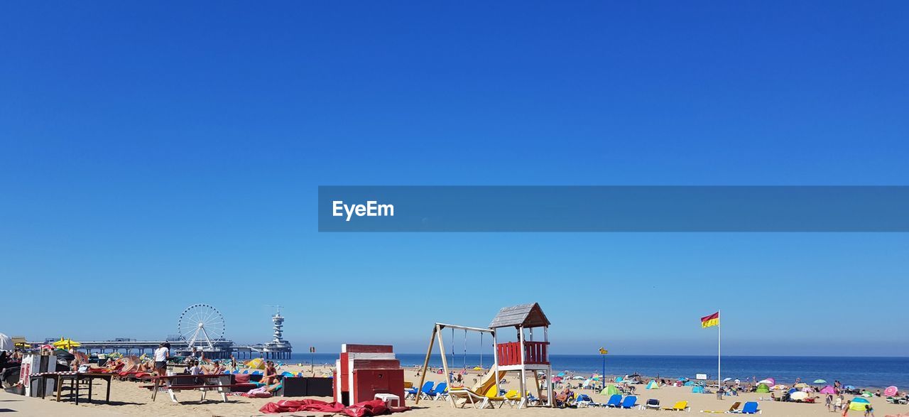 Scenic view of sea against clear blue sky