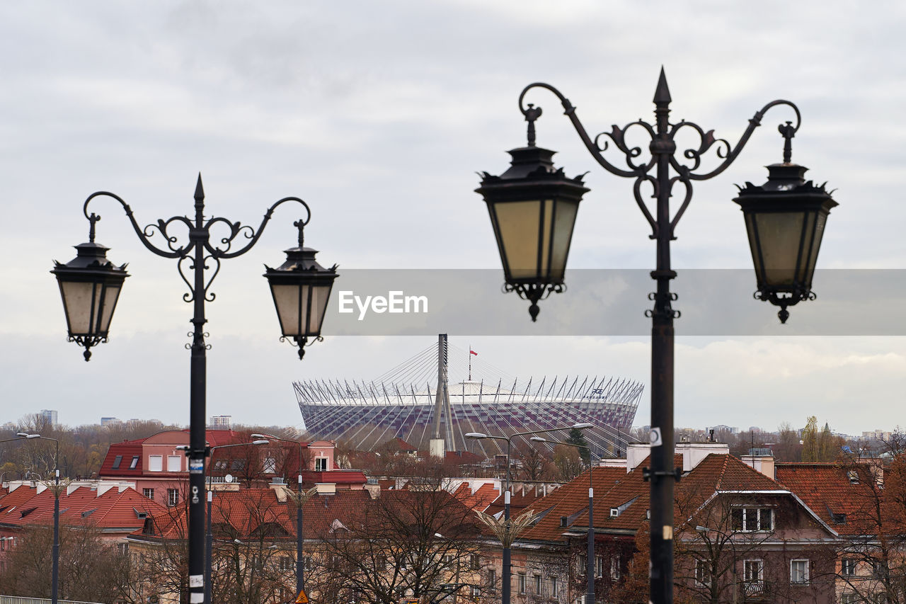 STREET LIGHT AGAINST SKY IN CITY