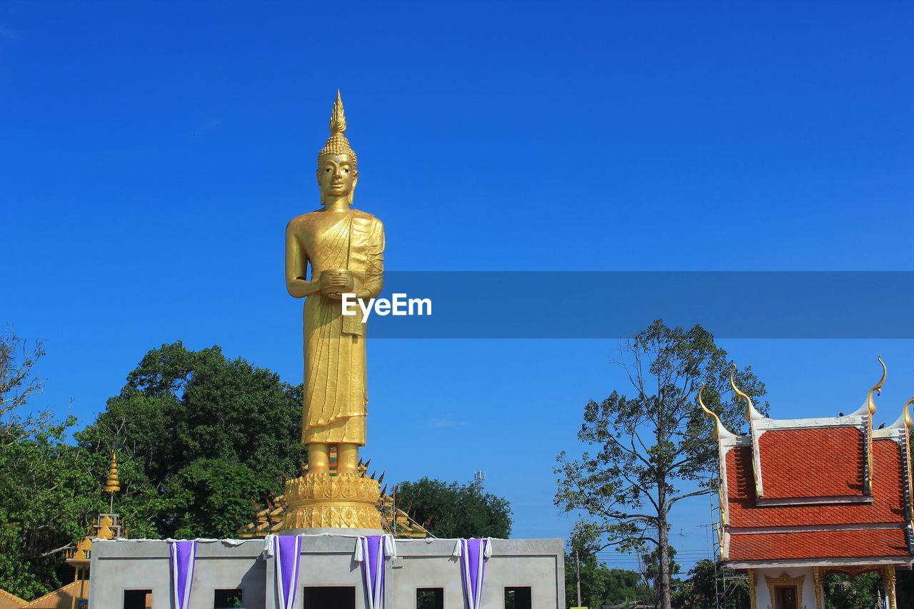 LOW ANGLE VIEW OF BUILT STRUCTURES AGAINST CLEAR BLUE SKY