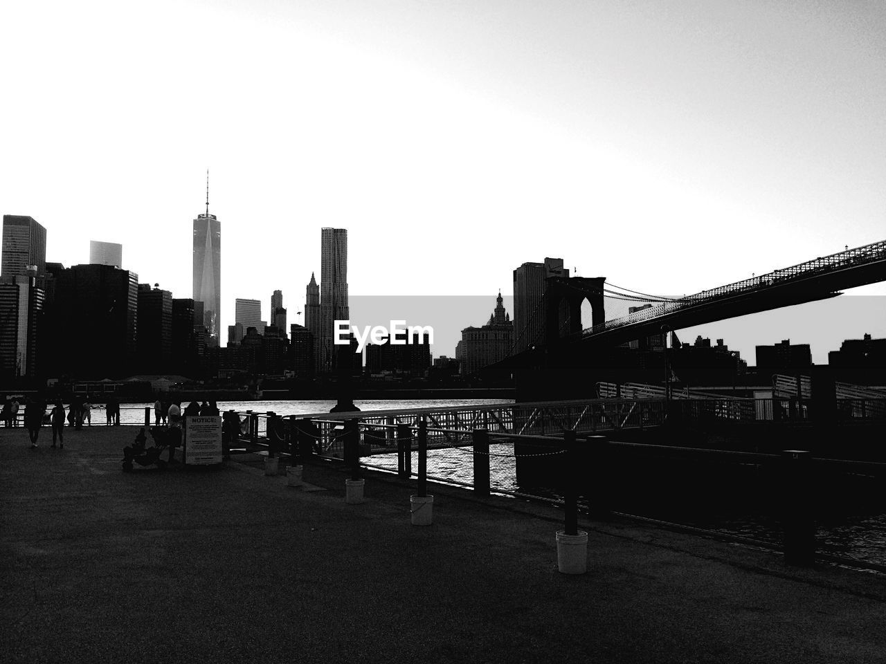 Cityscape and brooklyn bridge against sky