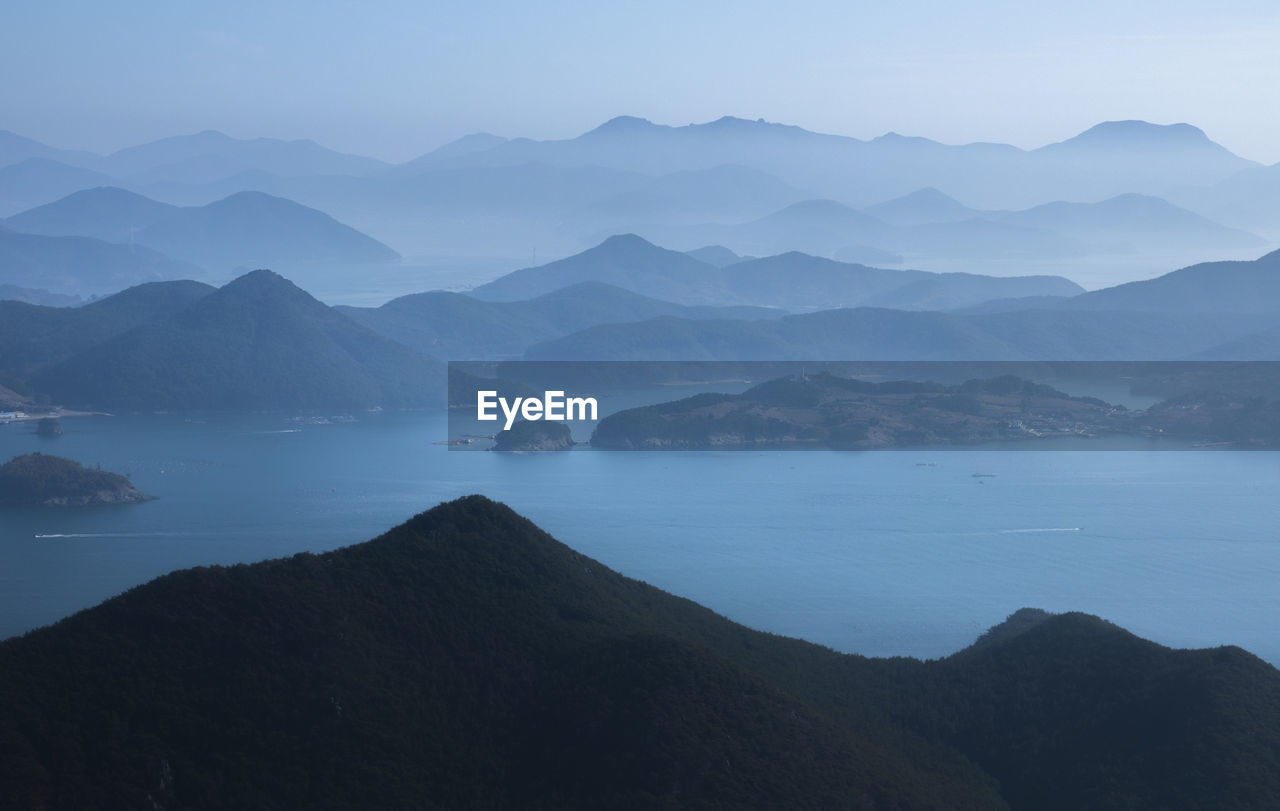 Scenic view of sea and islands against sky