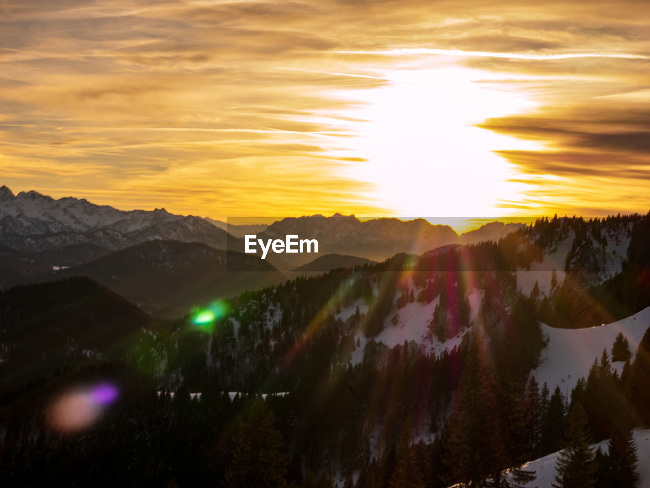 Scenic view of mountains against sky during sunset