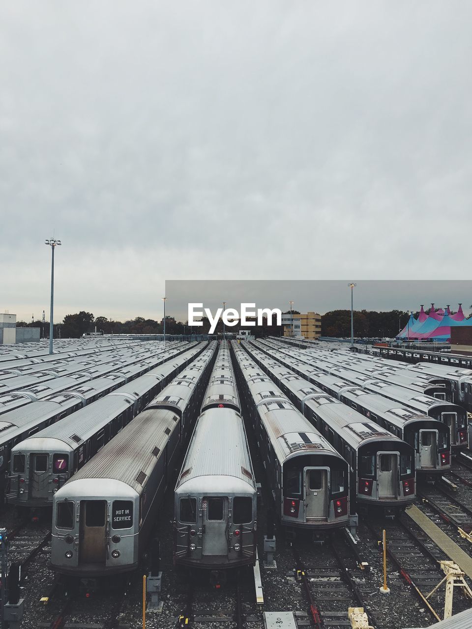 Train at railroad station against sky