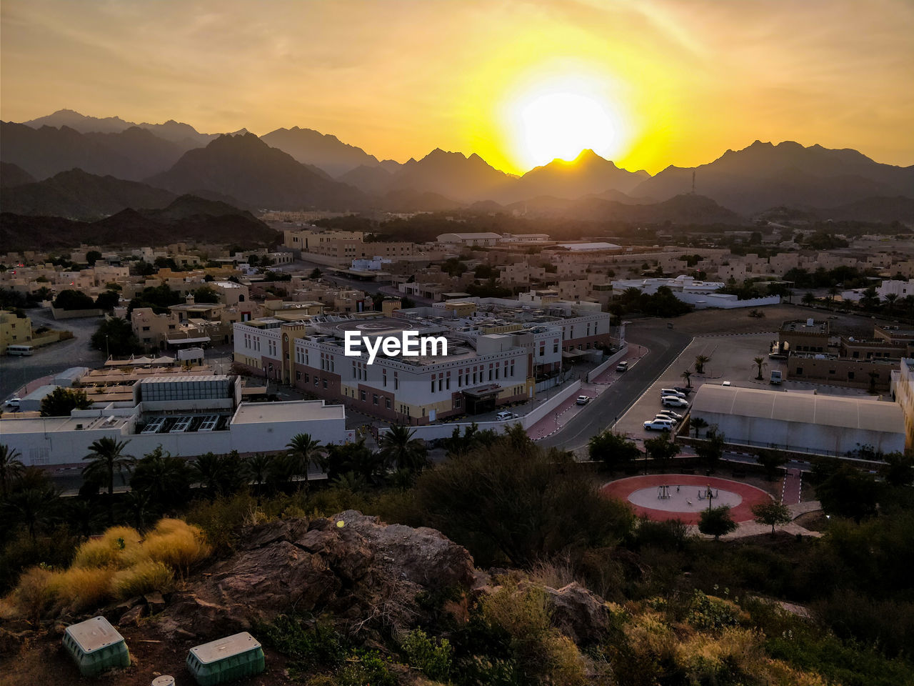 High angle view of town against sky during sunset