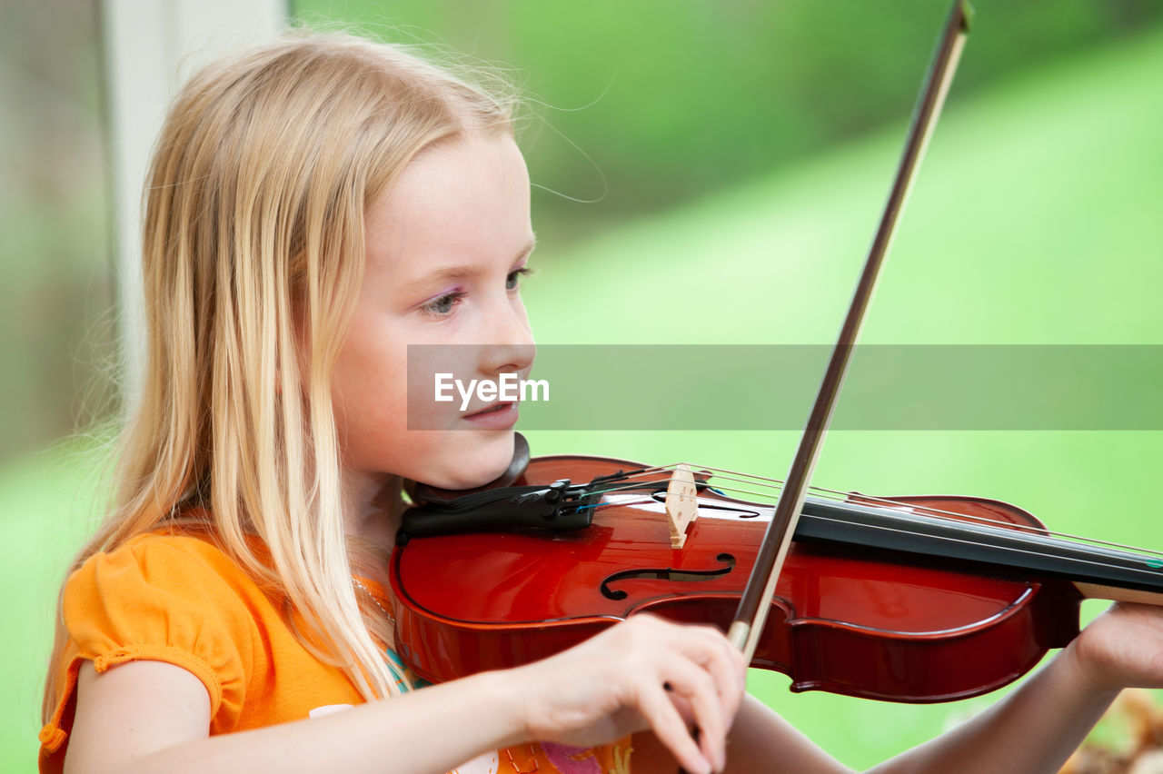 Portrait of girl playing in the background