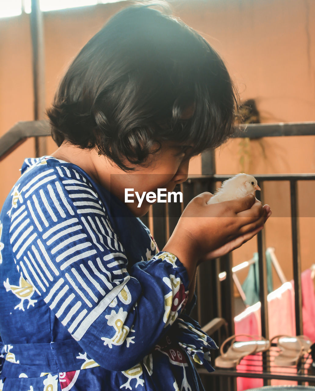 Portrait of boy holding camera