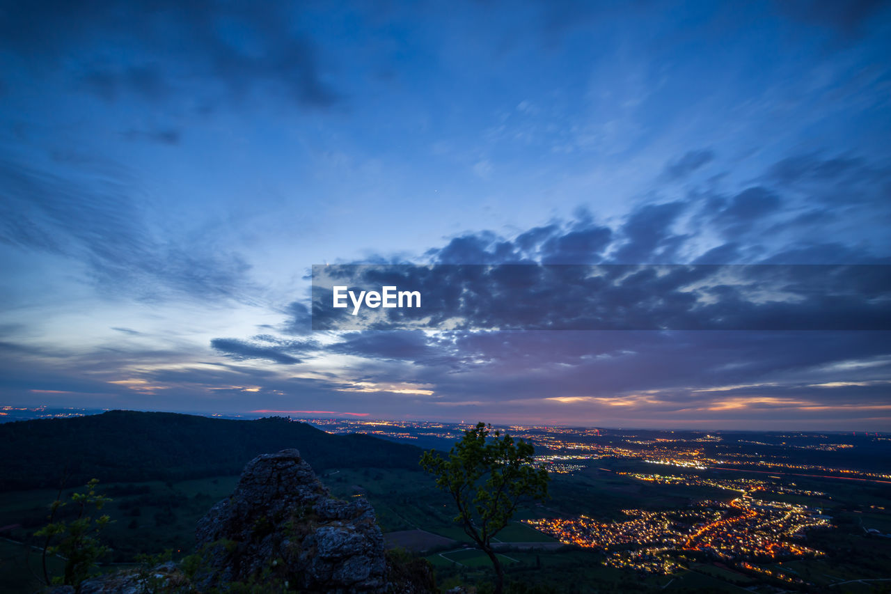 SCENIC VIEW OF LANDSCAPE AGAINST SKY DURING SUNSET