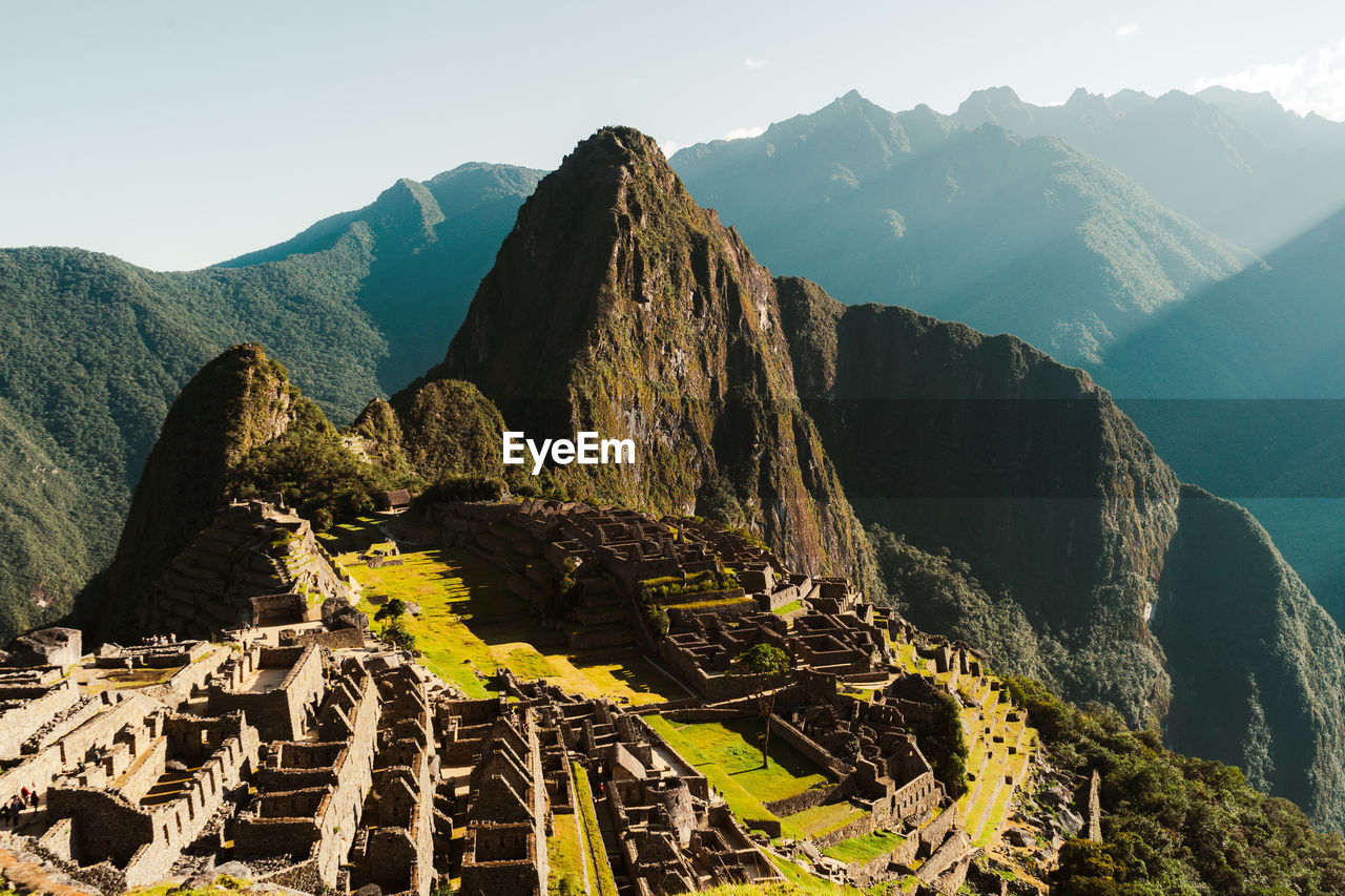 Machu picchu old inca ruins at sunrise in peru