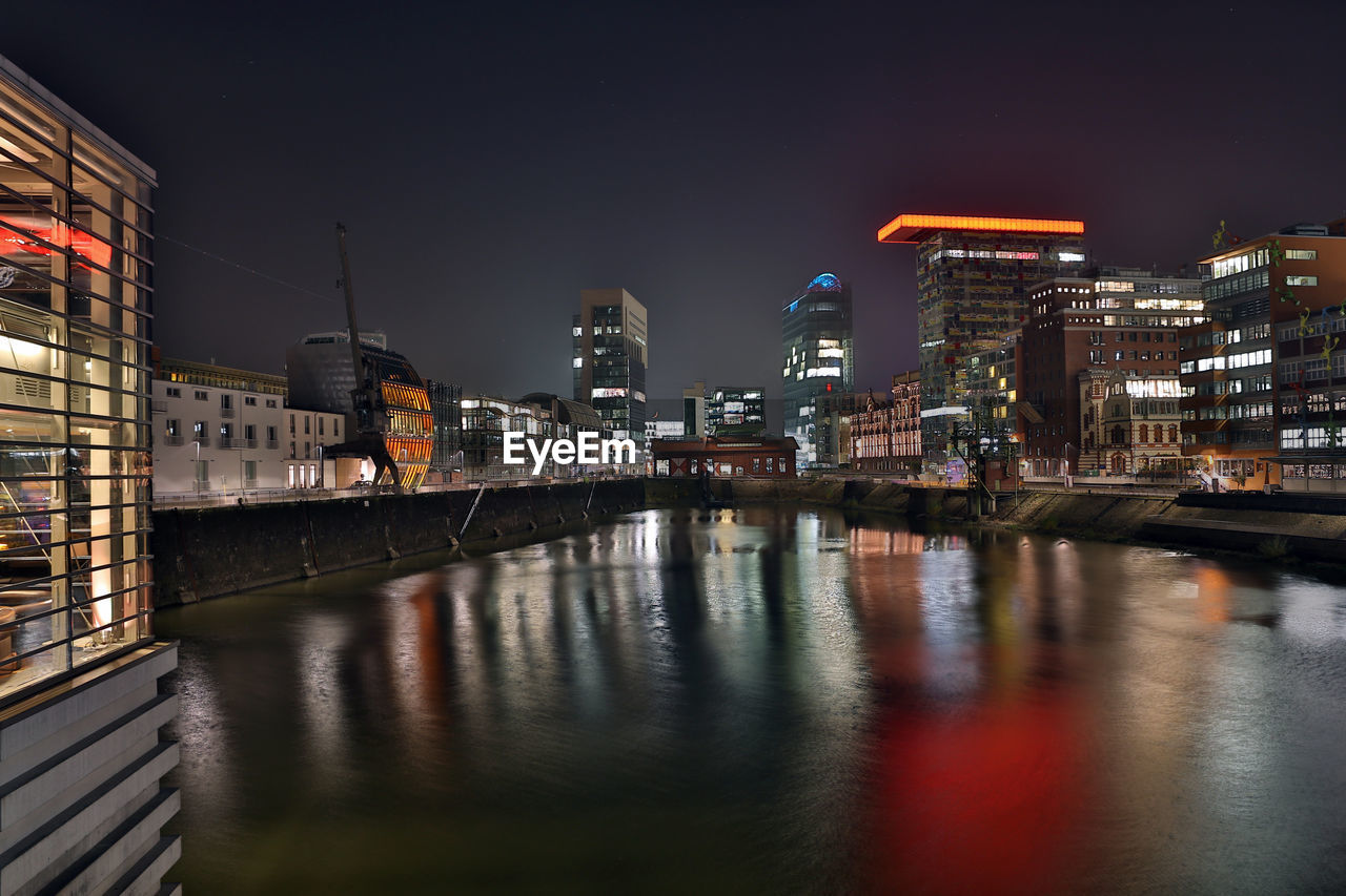 Dusseldorf media harbor district at night with modern office buildigs