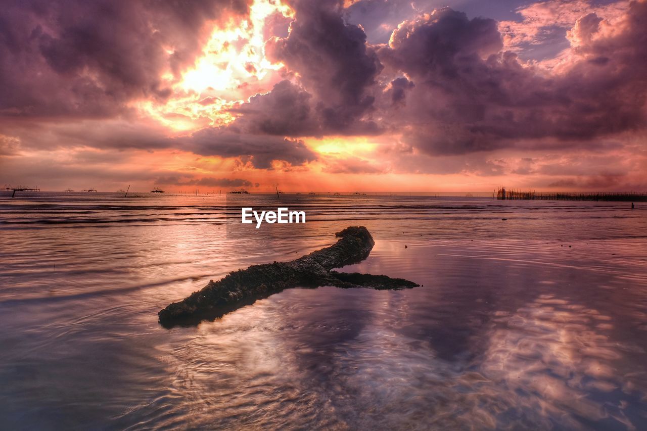 Scenic view of sea against sky during sunset