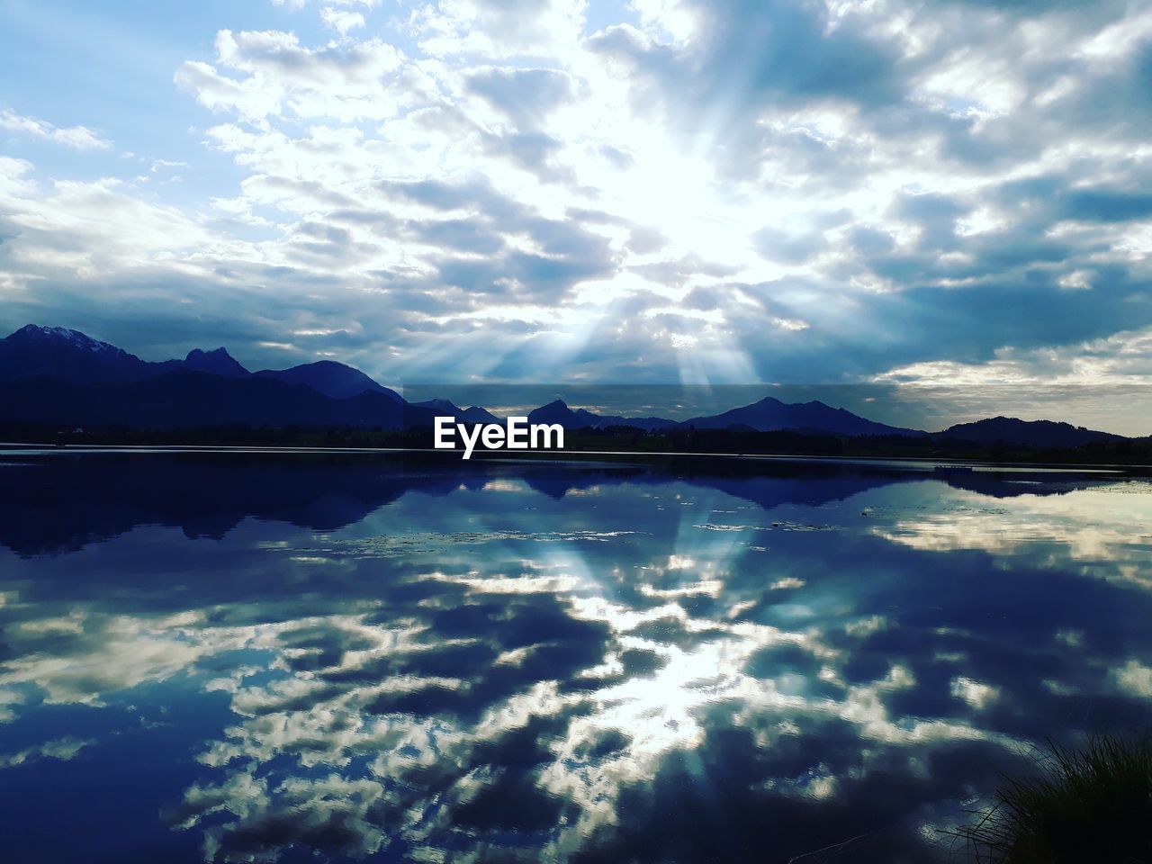 REFLECTION OF SKY ON LAKE