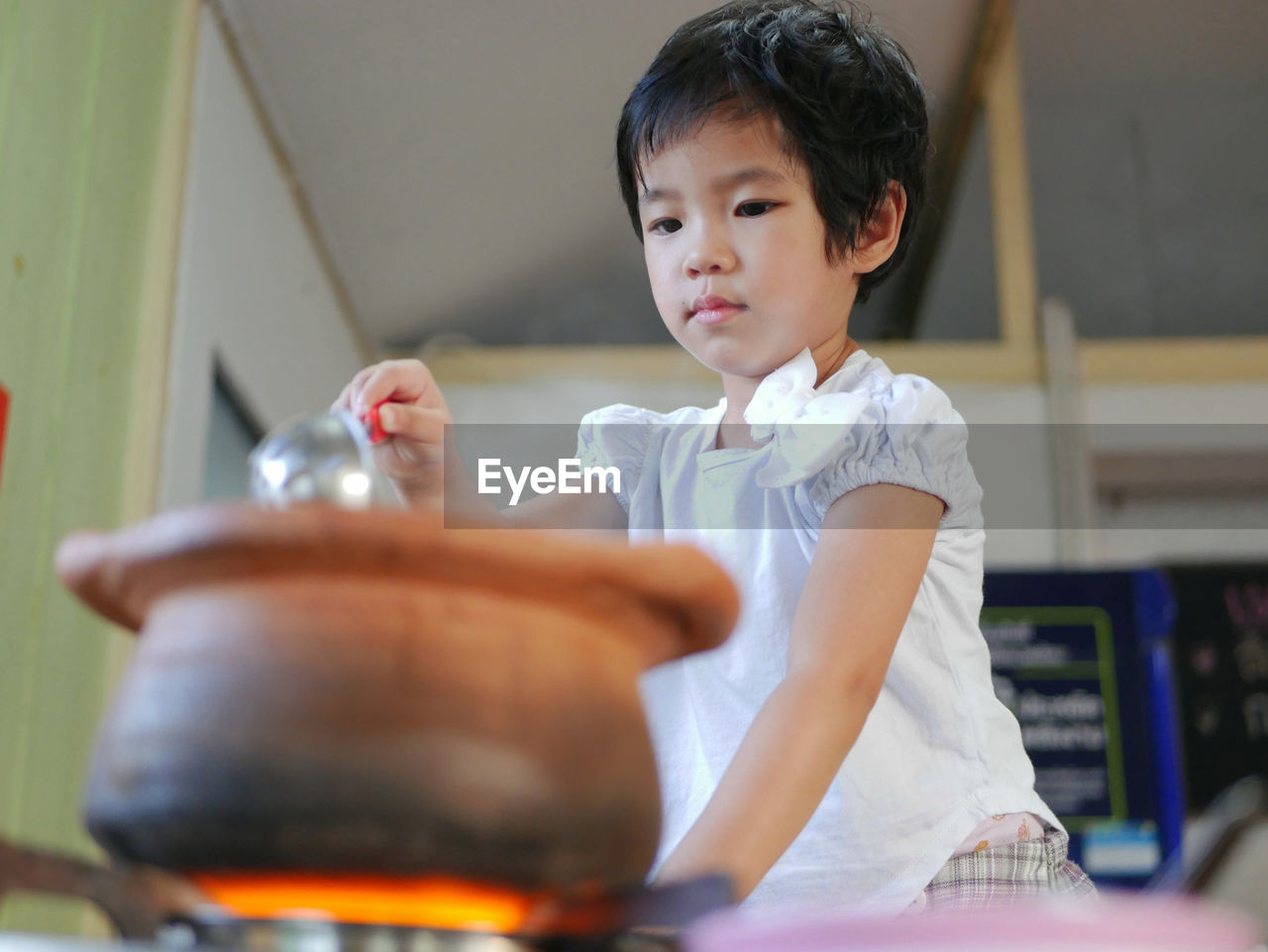 Girl cooking food in kitchen