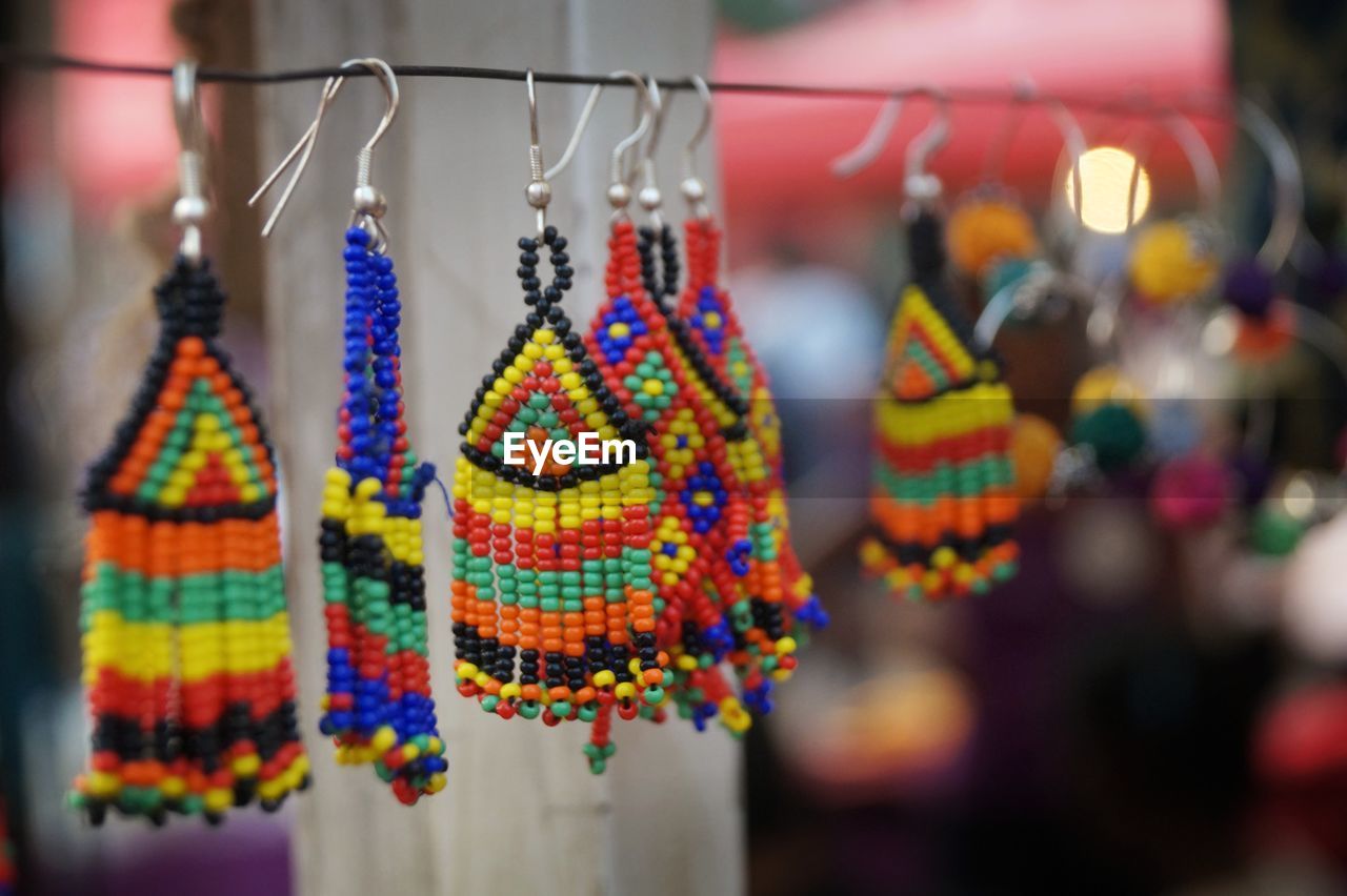 CLOSE-UP OF MULTI COLORED HANGING FOR SALE