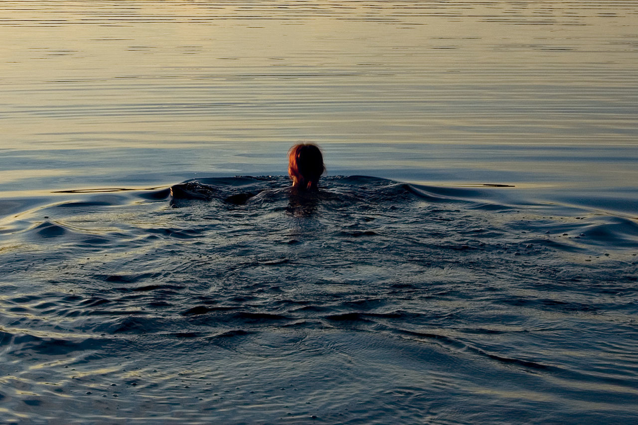 Woman swimming in sea