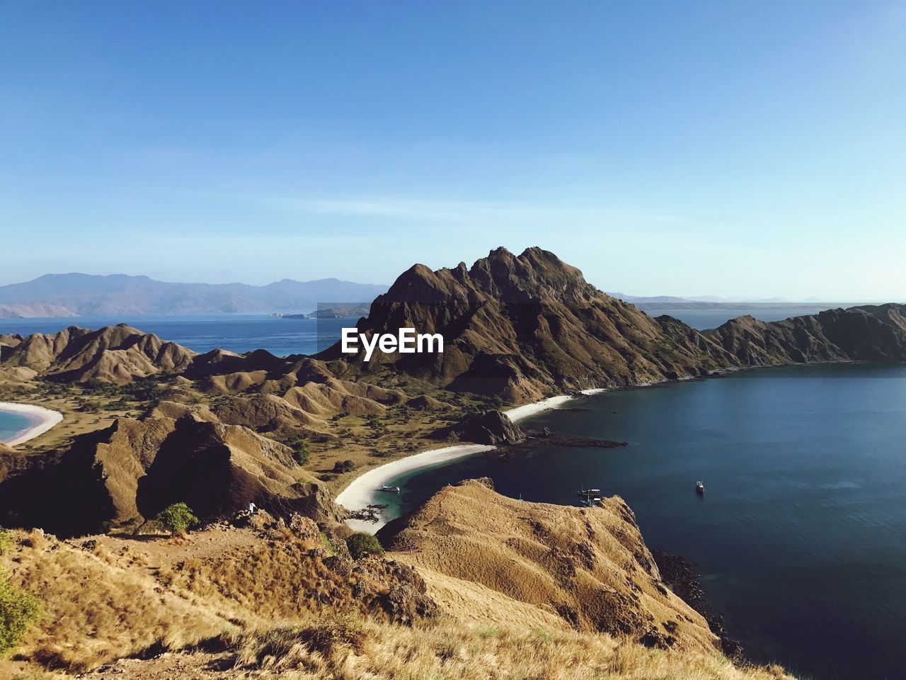 Scenic view of mountains against clear blue sky