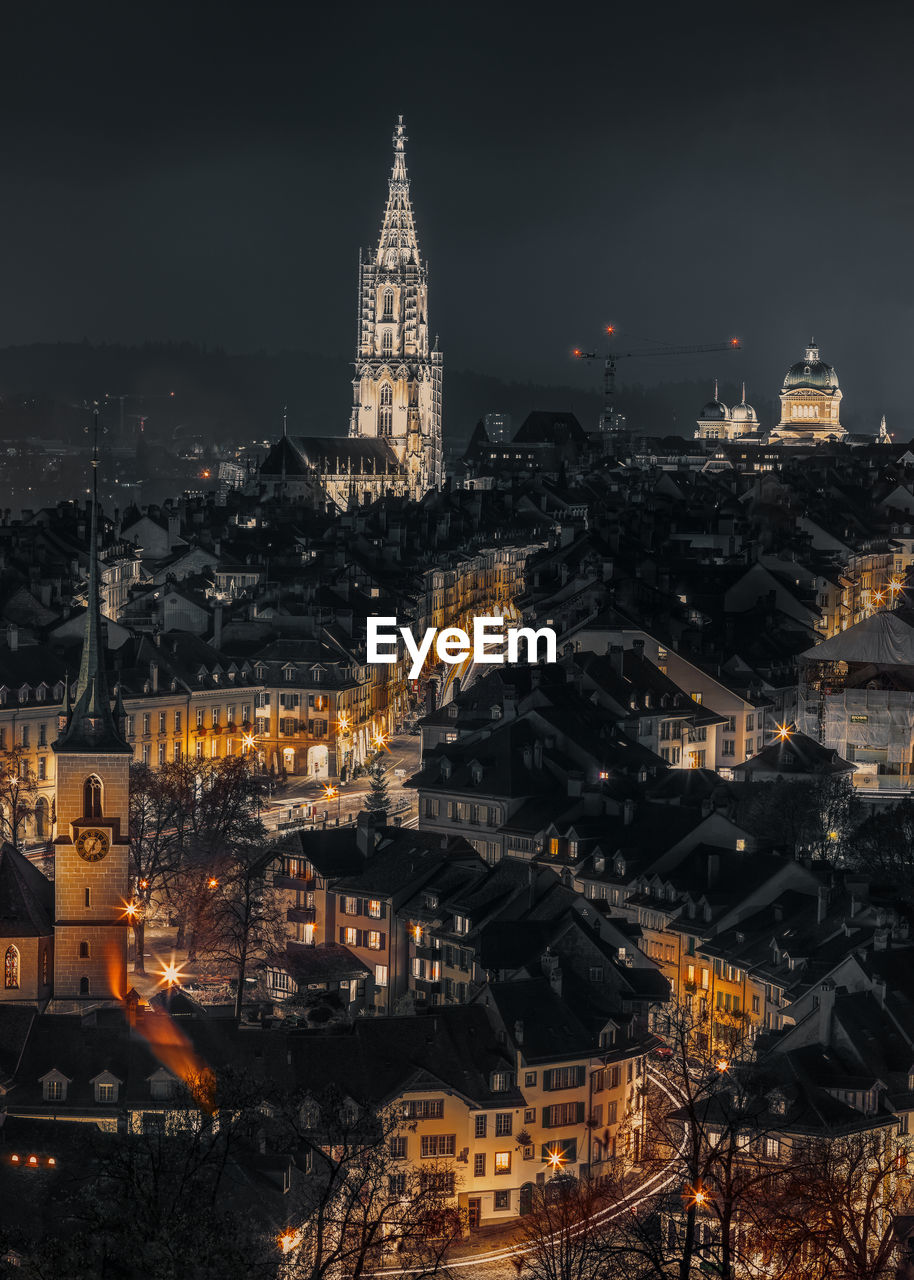 Illuminated buildings in city at night